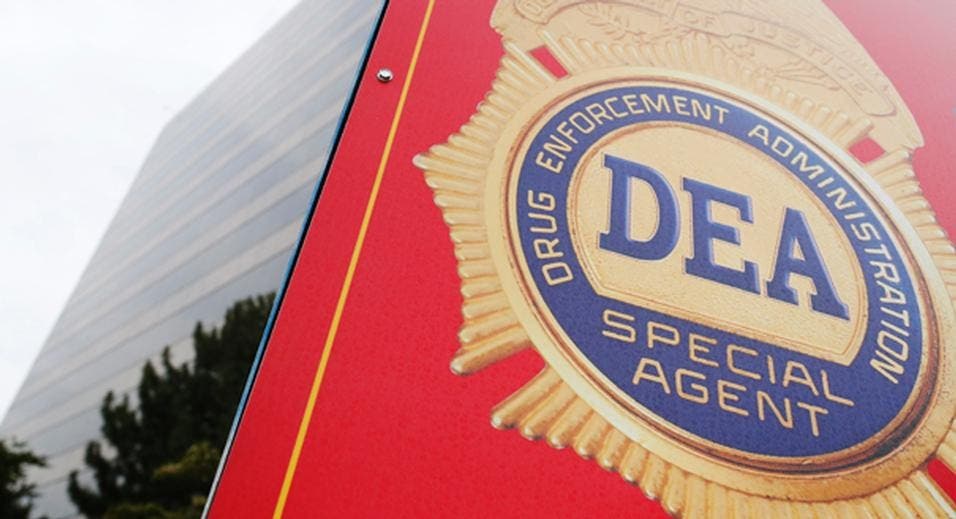 A sign with a DEA badge marks the entrance to the U.S. Drug Enforcement Administration (DEA) Museum in Arlington, Virginia